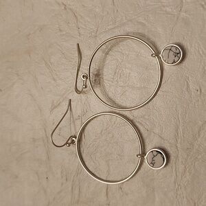 Dangle silver tone earrings with white accents drop faux stone